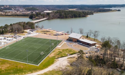 An aerial shot depicts a recreational area beside Lake Hartwell.