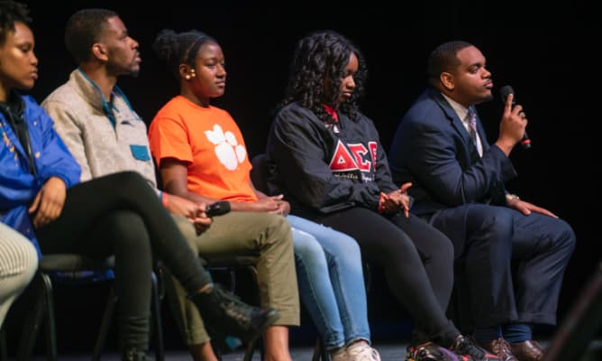 A panel of African American students sit together answering questions during an Experience Clemson event.
