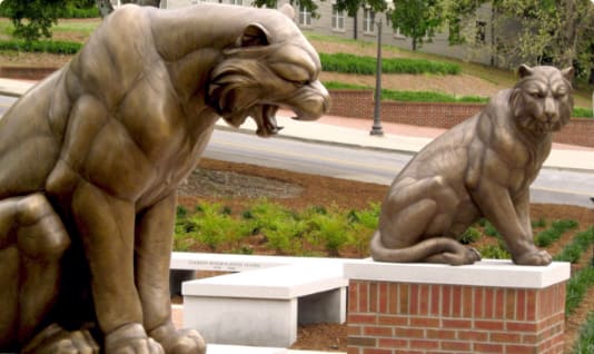 Two Tigers statues guard the entrance to Memorial Park and Scroll of Honor.
