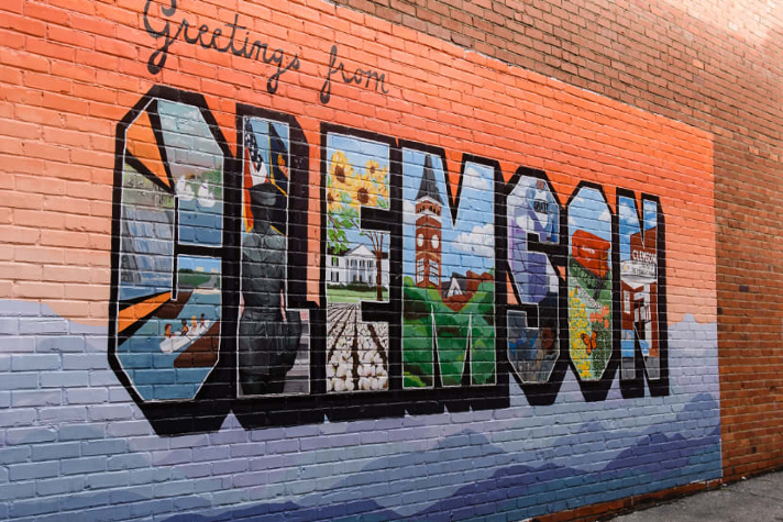A large mural covers the brick exterior of one of Clemson's downtown businesses.