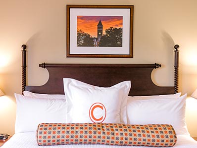 A comfortable, fresh bed sits in one of the rooms in the James F. Martin Inn.