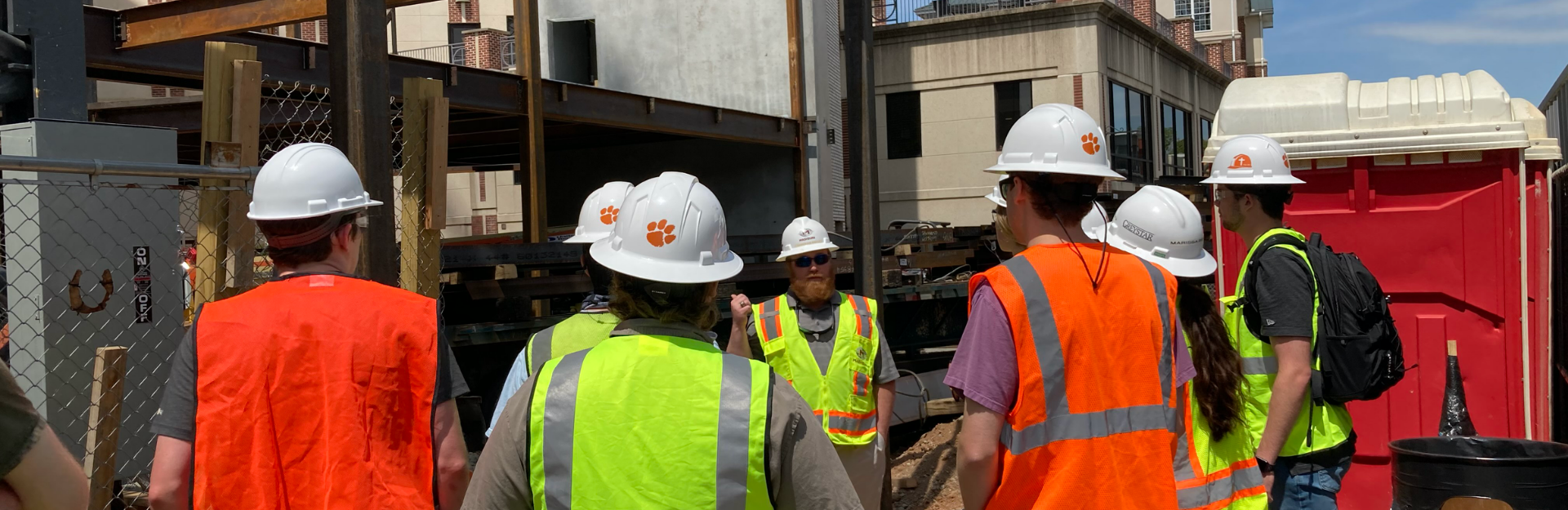 students touring a construction facility