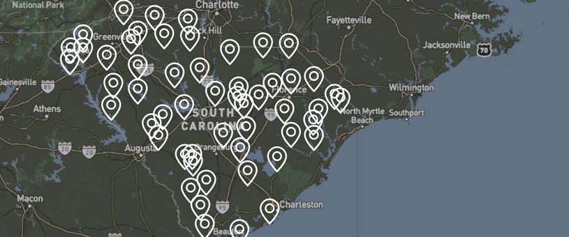 outlined map of south carolina with pin icons in various places across the state identifying weather station locations