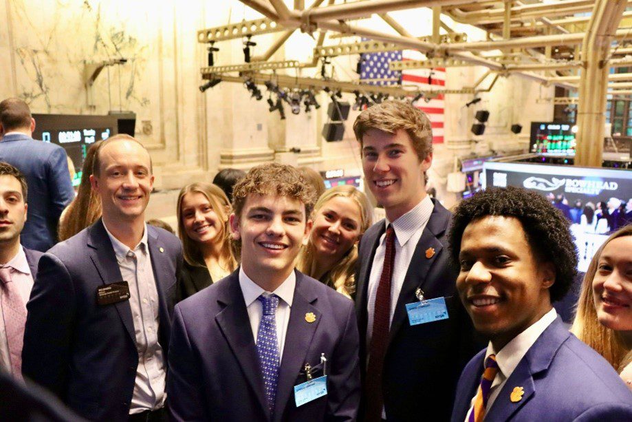 Finance students at NY stock exchange.