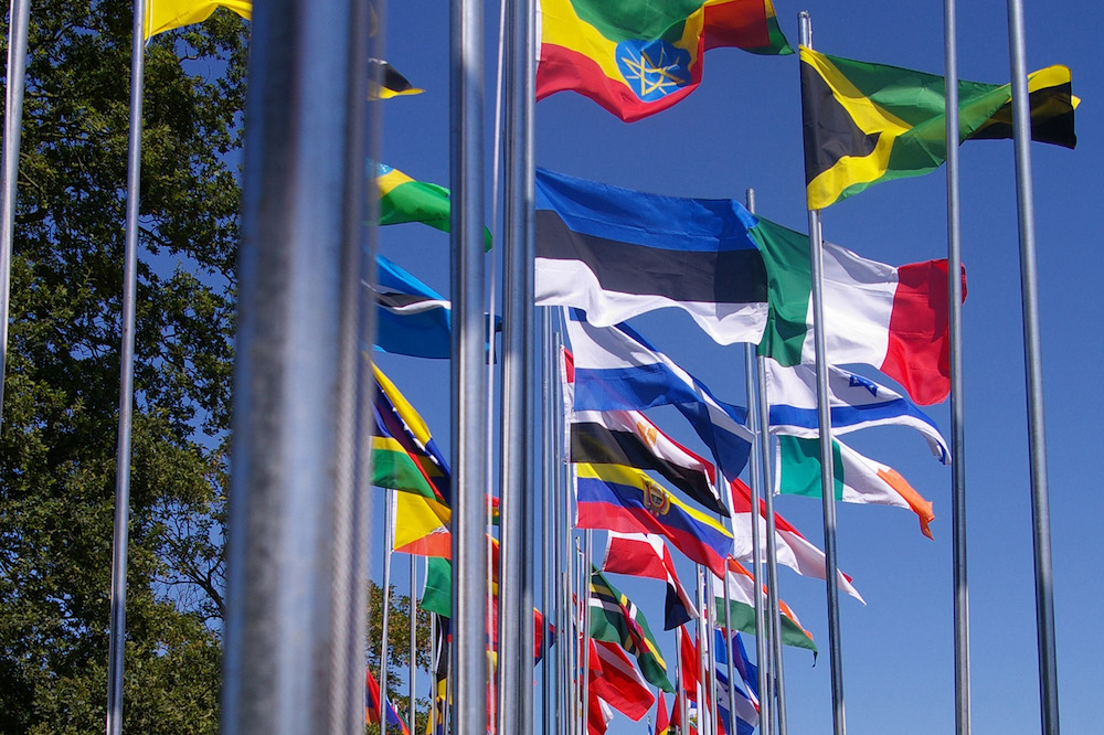 Flags of different countries flying outside of the United Nations building