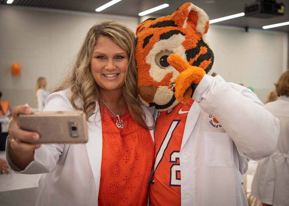 Clemson Nursing Alumni taking a selfie with the Clemson Tiger