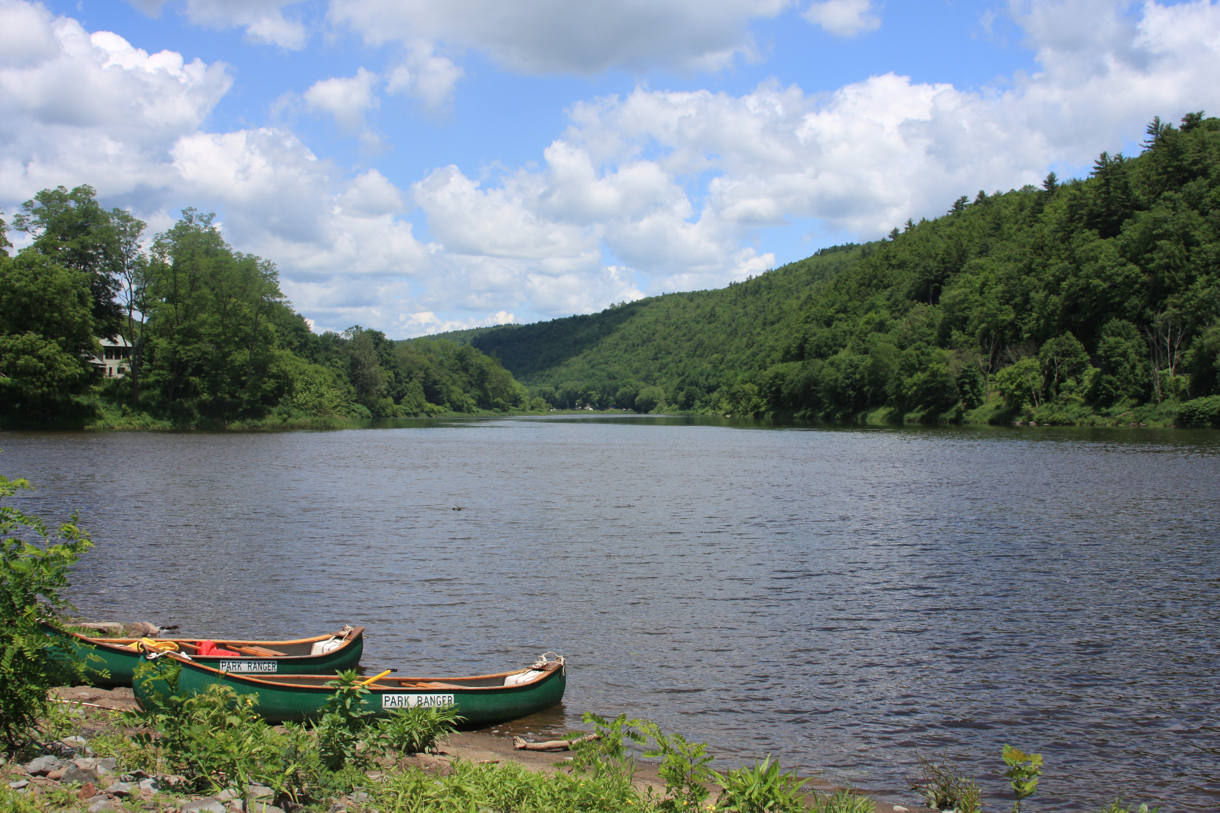 Photo of kayaks beside a lake. 