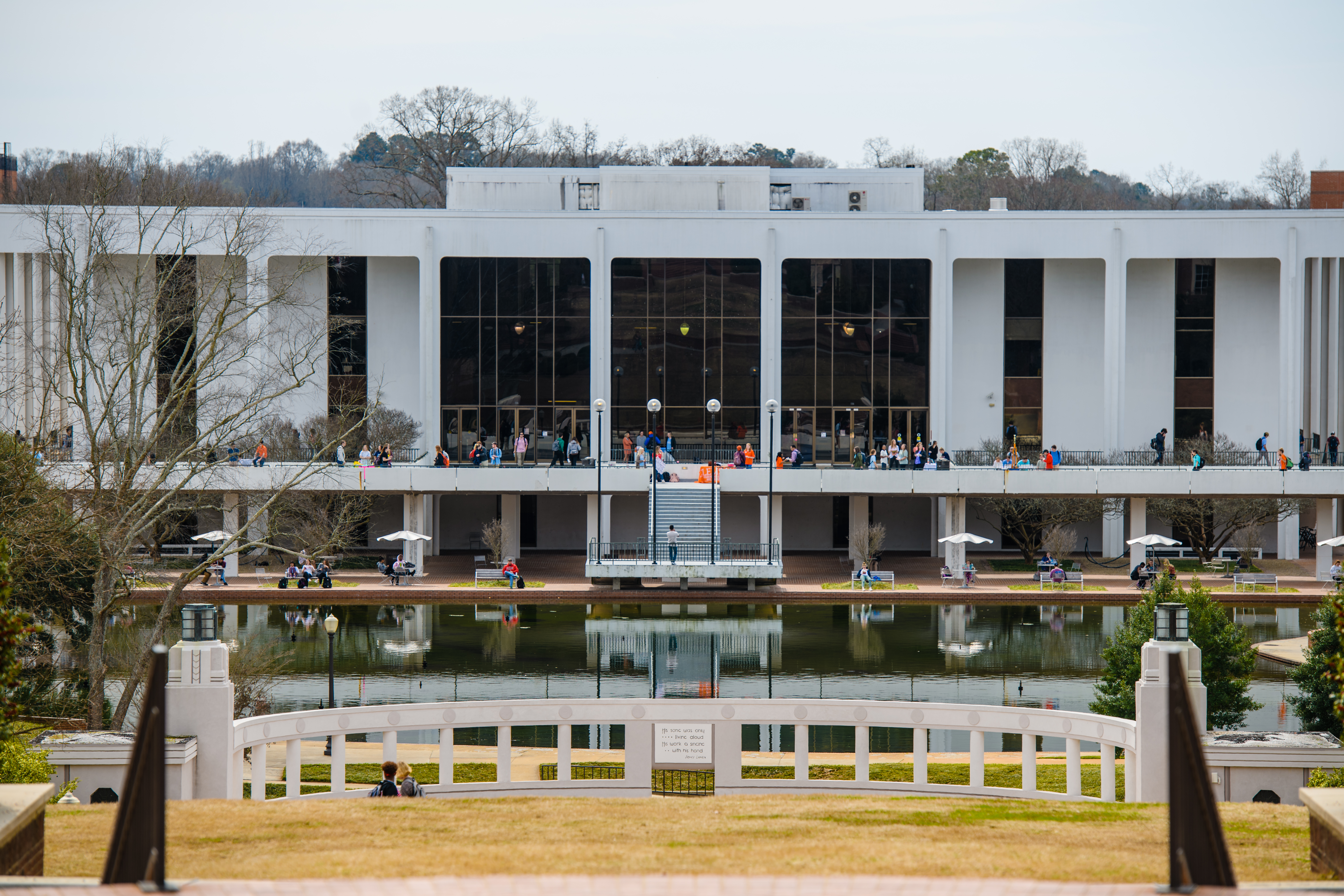 Picture of students on the walkway in front of Cooper Library on campus.