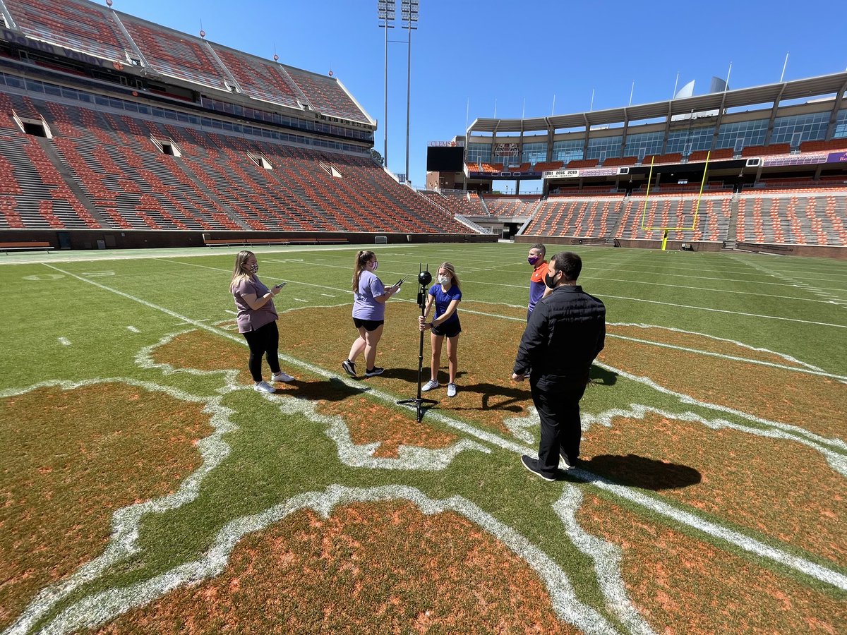 Clemson students taking virtual reality video footage of the football field at Memorial Stadium.