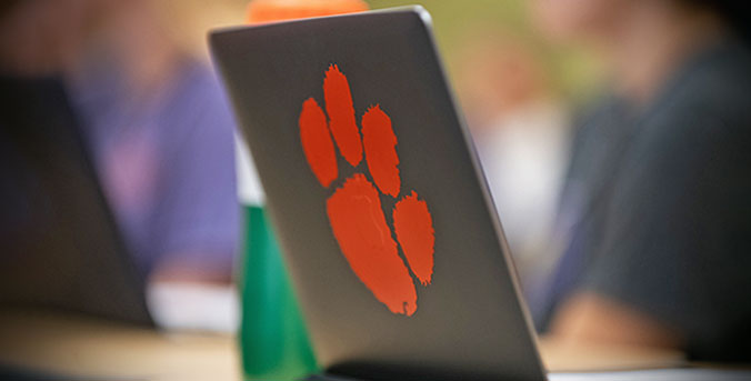 laptop with Clemson paw