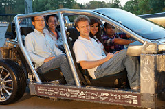 Students in frame of car