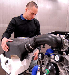 an automotive engineering student performs work during his internship