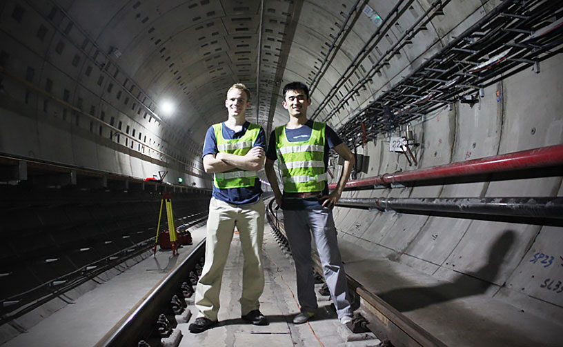 Two students standing in a tunnel in China during study abroad.