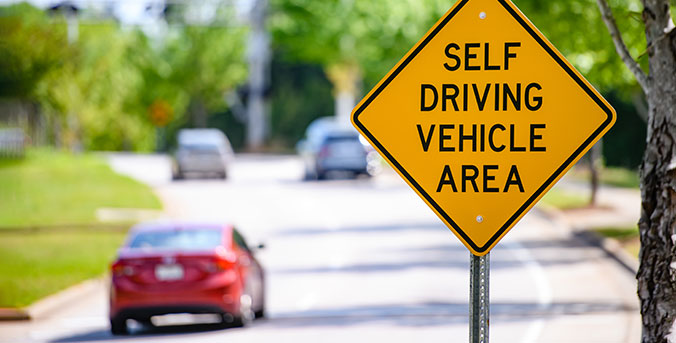 Signs says Self Driving Vehicle Area