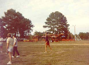 Student Serving a Volleyball