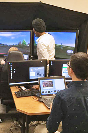 Students using driving simulator