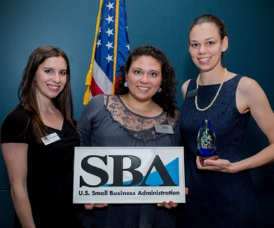 Photo of three ladies holding Small Business Development Logo
