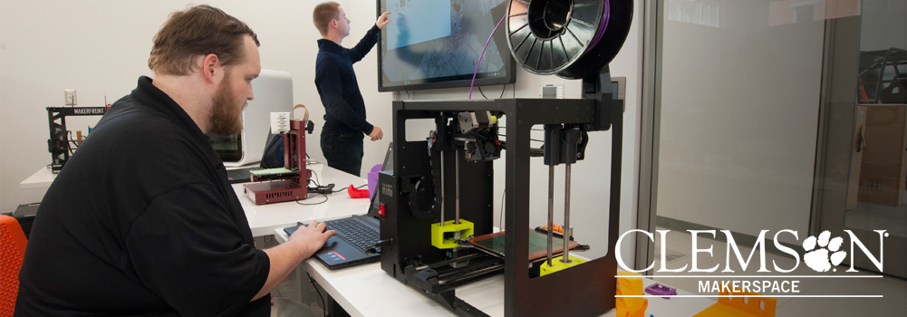 Two students work in the Clemson Makerspace, a space for 3D printing and prototyping.