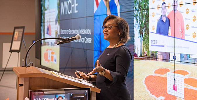 Wyche speaking at conference in Watt