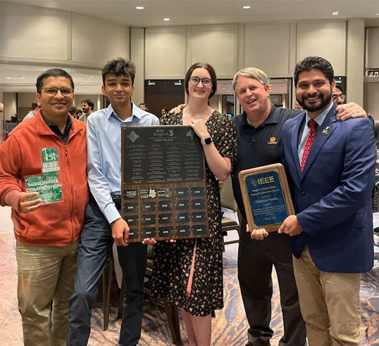 Group at IEEE competition holding awards