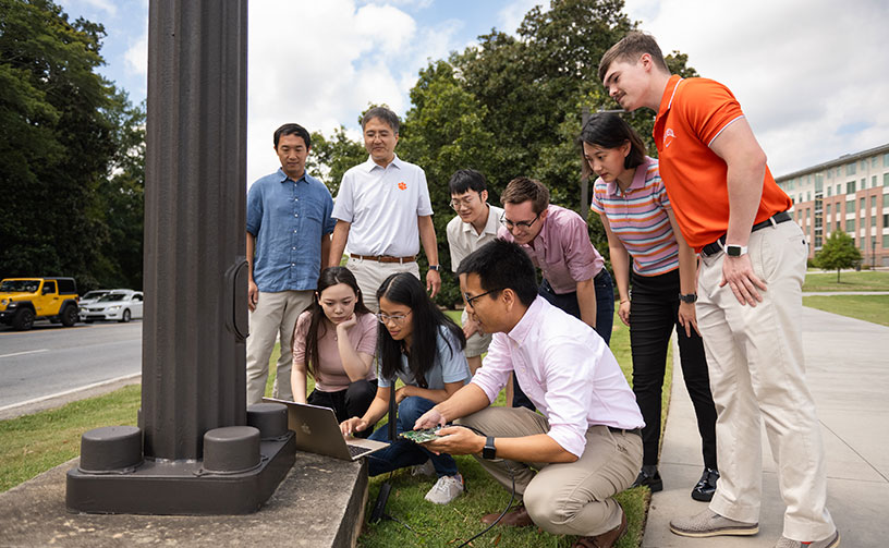 Faculty and students testing research along one of the campus roads.