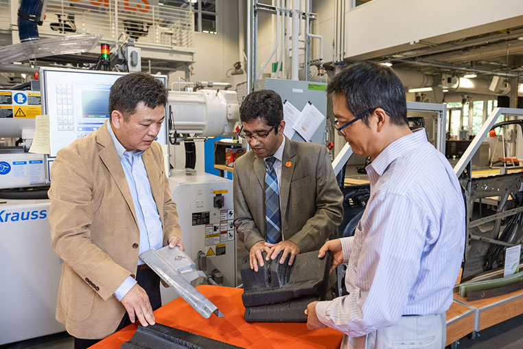 Gang Li, Feng Lou, Srikanth Pilla discussing composite materials.