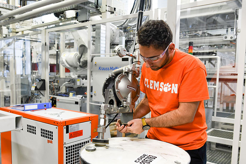 Student working inside Clemson Composites Center.