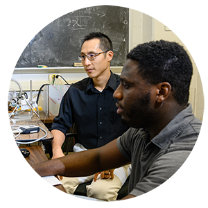 Ethan Kung with student as they work on virtual patient device