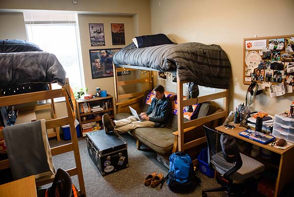 A student in an HRC dorm room.