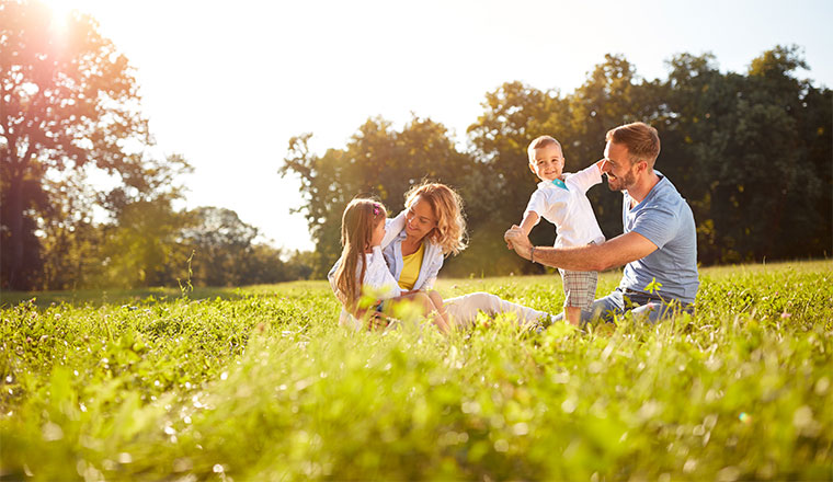 family playing in a field