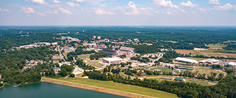 Clemson University campus with a lake visible in the background.