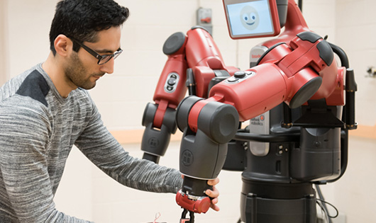 Man working with robot