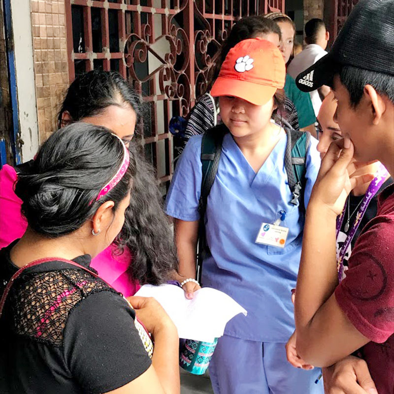 Student talking to locals in Panama
