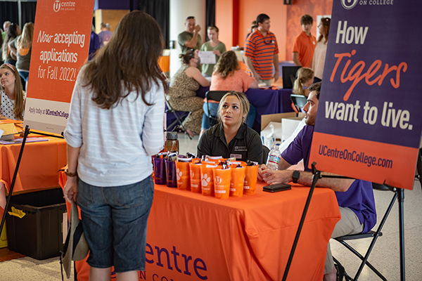 Clemson Student interacting with UCenter Staff at Clemson