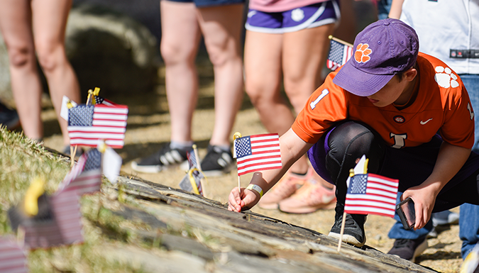 Students planting flag at Clemson University Scroll of Honor