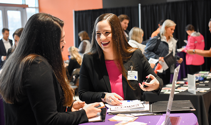 Student interacting with an employer at Spring Career Fair 2020