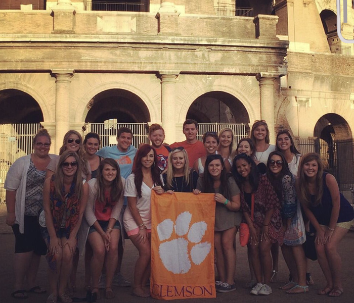 A group of students pose in Italy with the tiger rag