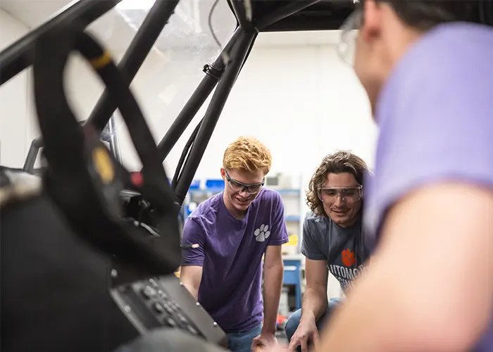 A graduate student researcher runs test on a prototype vehicle