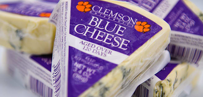 A triangle of Clemson Blue Cheese notes that it is aged over 120 days.