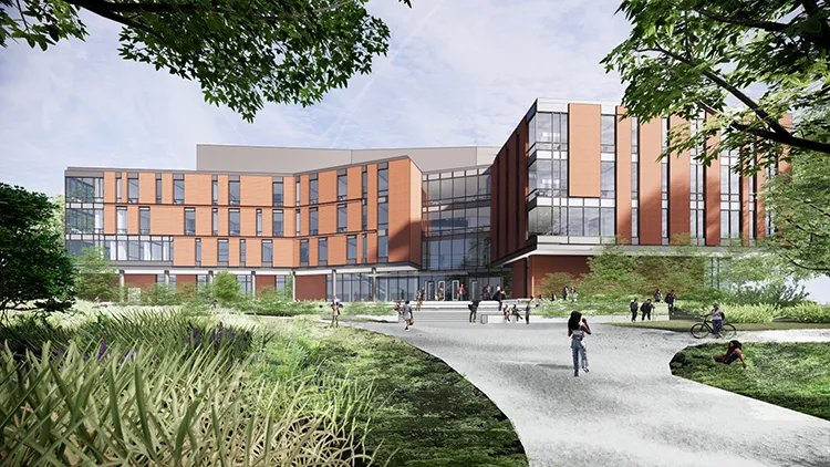 A rendering of the brick-and-glass Advanced Materials Innovation Complex with a concrete walking path that splits between green space.