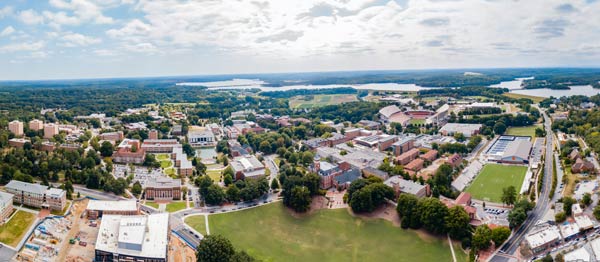 An aerial shot shows Clemson's campus, Lake Hartwell and the Blue Ridge Mountains.