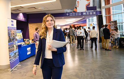 Student walks through Career Fair held at Littlejohn Coliseum.