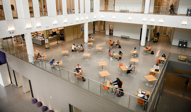 Multiple levels within the College of Business building displaying a lot of open study space.