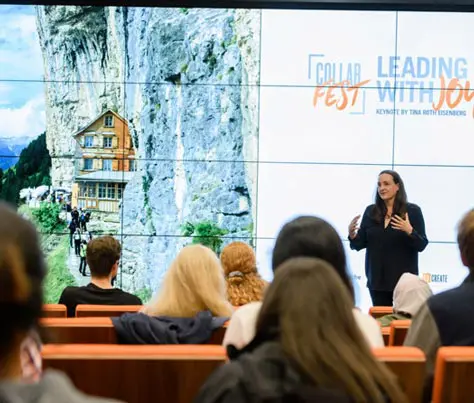 A guest speaker gives a talk in the Watt Center to a group of students and faculty