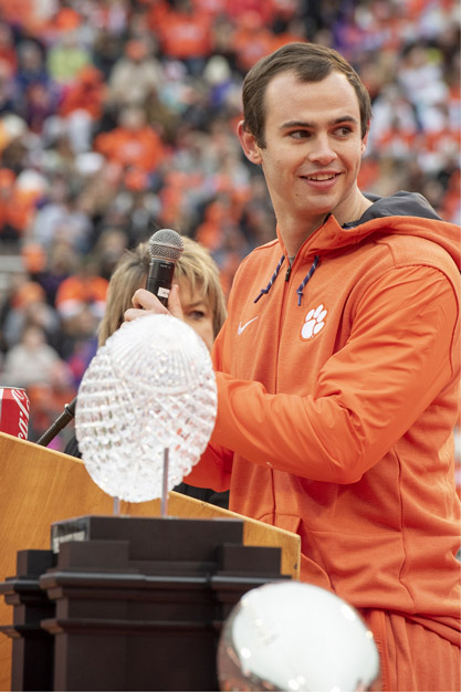 Hunter is giving a speech in the football stadium after recieving an award.