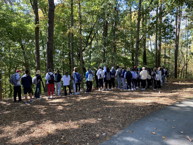 A class taking a tour of the cemetery.