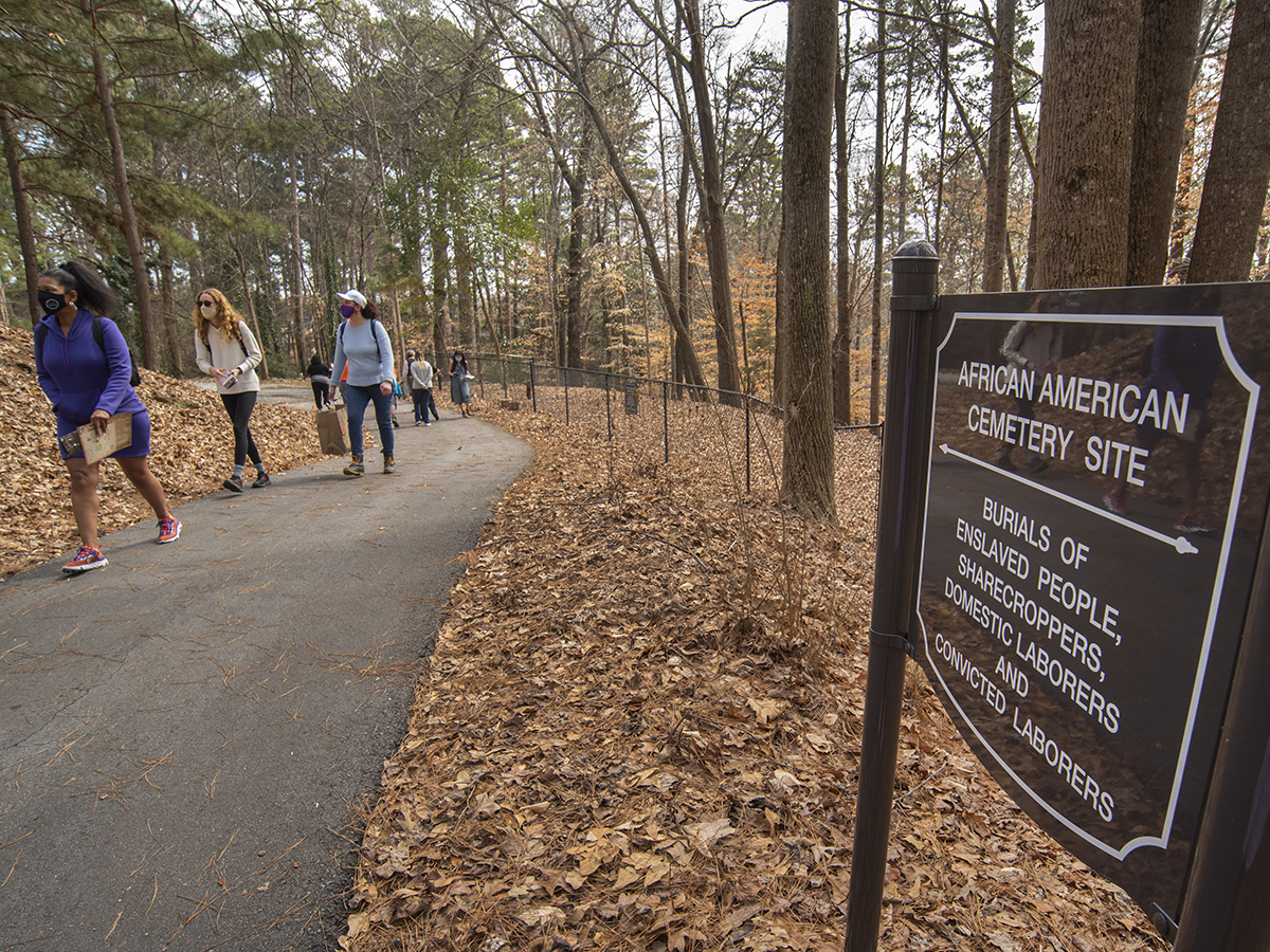 A group takes a tour of Woodland Cemetery and the African American Burial Ground. Photo by Patrick D. Wright.