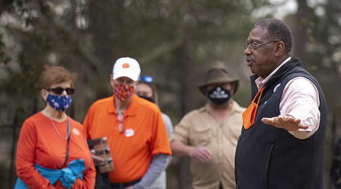 Dr. James Bostic, Jr. talks to a group on a tour of the African American Burial Ground and Woodland Cemetery.