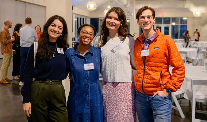 Four NSP alumni posing together at the celebration. 