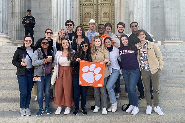 Several National Scholars posing with a tiger rag in Spain. 